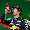 SHANGHAI INTERNATIONAL CIRCUIT, CHINA - APRIL 15: Daniel Ricciardo, Red Bull Racing, 1st position, drinks from his shoe on the podium during the Chinese GP at Shanghai International Circuit on April 15, 2018 in Shanghai International Circuit, China. (Photo by Andy Hone / LAT Images)
